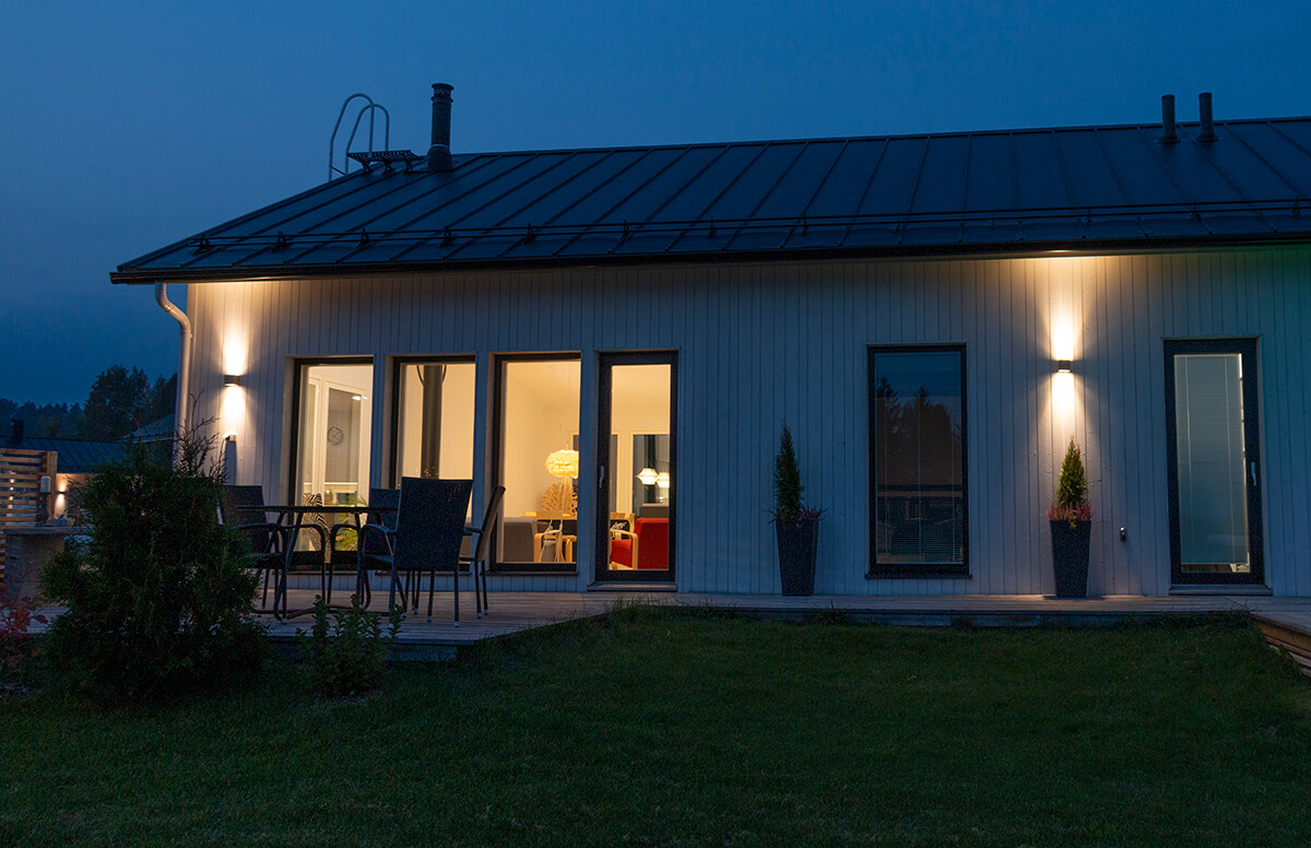 Exterior lights on the exterior wall of the dwelling