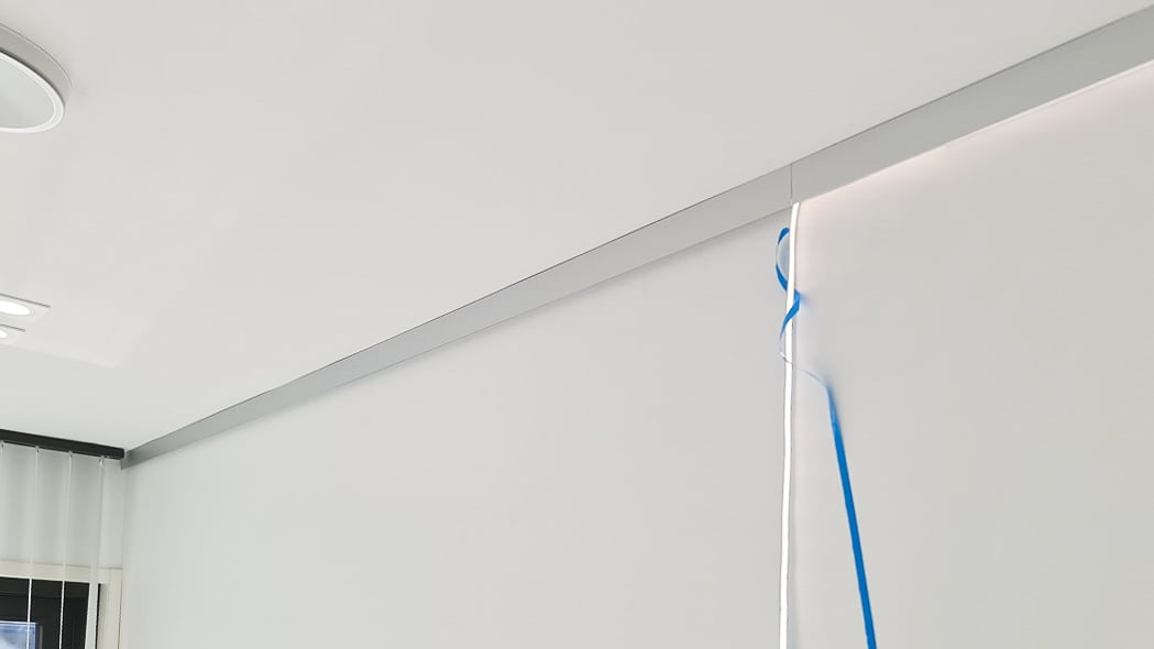 Mounting the aluminum profiles and attaching the LED strip.